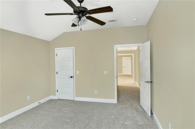 THIS SPACIOUS FOUR-BEDROOM HOME OFFERS OVER 2,700 SQUARE FEET OF on Laurel Island Links in Georgia - for sale on GolfHomes.com, golf home, golf lot