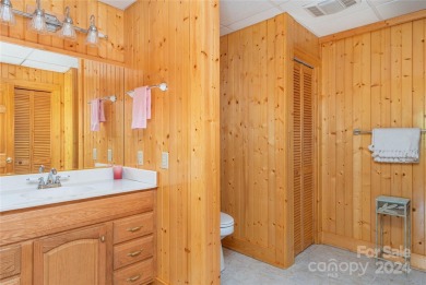 NO DAMAGE FROM HELENE-HIGH  DRY. This warm and inviting log home on Waynesville Country Club Inn in North Carolina - for sale on GolfHomes.com, golf home, golf lot