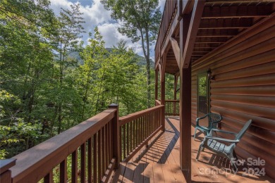 NO DAMAGE FROM HELENE-HIGH  DRY. This warm and inviting log home on Waynesville Country Club Inn in North Carolina - for sale on GolfHomes.com, golf home, golf lot