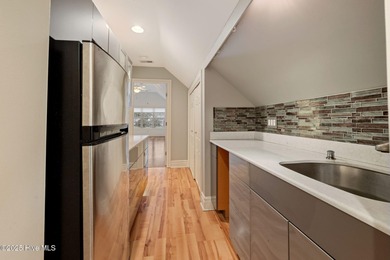 Welcome to your beautiful brick home overlooking a peaceful pond on Cape Fear National At Brunswick Forest in North Carolina - for sale on GolfHomes.com, golf home, golf lot