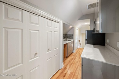 Welcome to your beautiful brick home overlooking a peaceful pond on Cape Fear National At Brunswick Forest in North Carolina - for sale on GolfHomes.com, golf home, golf lot