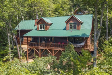 NO DAMAGE FROM HELENE-HIGH  DRY. This warm and inviting log home on Waynesville Country Club Inn in North Carolina - for sale on GolfHomes.com, golf home, golf lot