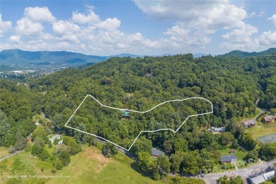 NO DAMAGE FROM HELENE-HIGH  DRY. This warm and inviting log home on Waynesville Country Club Inn in North Carolina - for sale on GolfHomes.com, golf home, golf lot