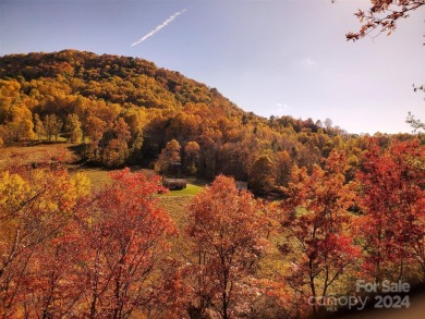 NO DAMAGE FROM HELENE-HIGH  DRY. This warm and inviting log home on Waynesville Country Club Inn in North Carolina - for sale on GolfHomes.com, golf home, golf lot