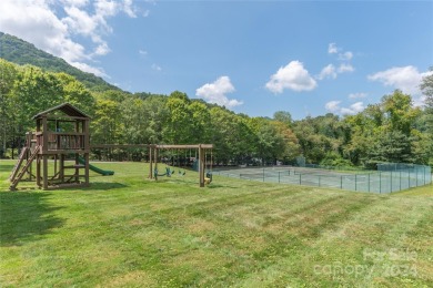 NO DAMAGE FROM HELENE-HIGH  DRY. This warm and inviting log home on Waynesville Country Club Inn in North Carolina - for sale on GolfHomes.com, golf home, golf lot