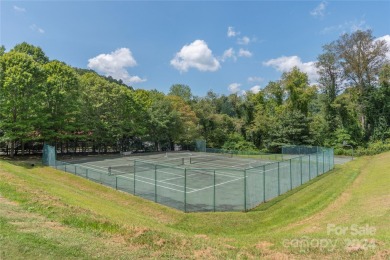 NO DAMAGE FROM HELENE-HIGH  DRY. This warm and inviting log home on Waynesville Country Club Inn in North Carolina - for sale on GolfHomes.com, golf home, golf lot