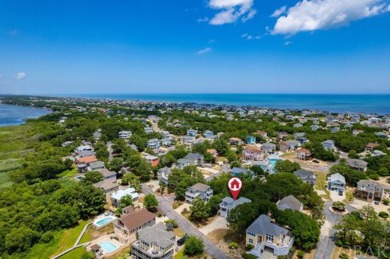 An extensive and pricey exterior transformation on this on The Currituck Golf Club in North Carolina - for sale on GolfHomes.com, golf home, golf lot