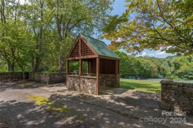 NO DAMAGE FROM HELENE-HIGH  DRY. This warm and inviting log home on Waynesville Country Club Inn in North Carolina - for sale on GolfHomes.com, golf home, golf lot