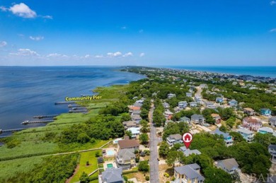 An extensive and pricey exterior transformation on this on The Currituck Golf Club in North Carolina - for sale on GolfHomes.com, golf home, golf lot