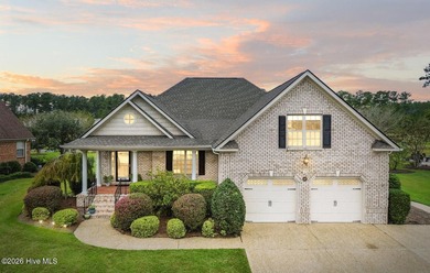 Welcome to your beautiful brick home overlooking a peaceful pond on Cape Fear National At Brunswick Forest in North Carolina - for sale on GolfHomes.com, golf home, golf lot
