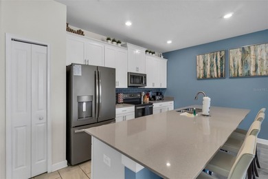 Welcome to a beautifully maintained, MOVE-IN READY townhome in on The Oasis Club at Champions Gate in Florida - for sale on GolfHomes.com, golf home, golf lot