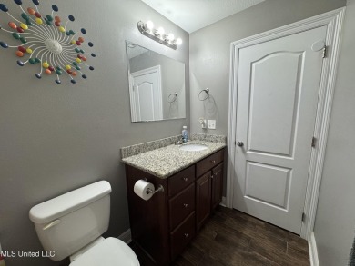Don't miss out on this perfect home next to the serene Twin on Diamondhead Country Club in Mississippi - for sale on GolfHomes.com, golf home, golf lot