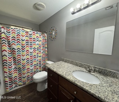 Don't miss out on this perfect home next to the serene Twin on Diamondhead Country Club in Mississippi - for sale on GolfHomes.com, golf home, golf lot