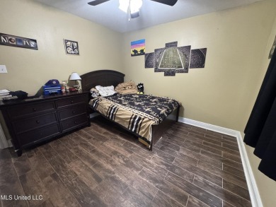 Don't miss out on this perfect home next to the serene Twin on Diamondhead Country Club in Mississippi - for sale on GolfHomes.com, golf home, golf lot