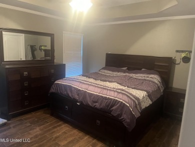 Don't miss out on this perfect home next to the serene Twin on Diamondhead Country Club in Mississippi - for sale on GolfHomes.com, golf home, golf lot