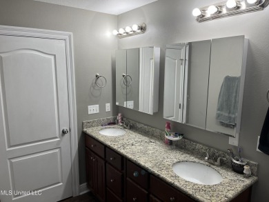 Don't miss out on this perfect home next to the serene Twin on Diamondhead Country Club in Mississippi - for sale on GolfHomes.com, golf home, golf lot
