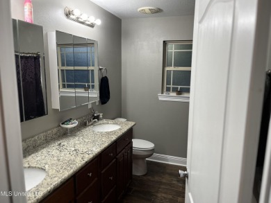 Don't miss out on this perfect home next to the serene Twin on Diamondhead Country Club in Mississippi - for sale on GolfHomes.com, golf home, golf lot