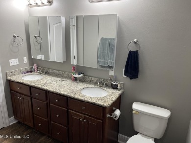Don't miss out on this perfect home next to the serene Twin on Diamondhead Country Club in Mississippi - for sale on GolfHomes.com, golf home, golf lot