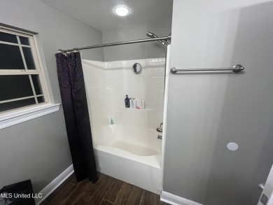 Don't miss out on this perfect home next to the serene Twin on Diamondhead Country Club in Mississippi - for sale on GolfHomes.com, golf home, golf lot