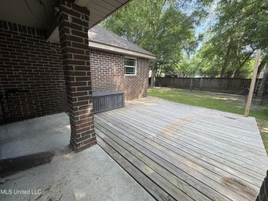 Don't miss out on this perfect home next to the serene Twin on Diamondhead Country Club in Mississippi - for sale on GolfHomes.com, golf home, golf lot