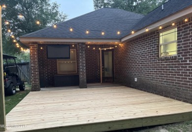 Don't miss out on this perfect home next to the serene Twin on Diamondhead Country Club in Mississippi - for sale on GolfHomes.com, golf home, golf lot