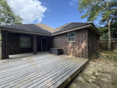 Don't miss out on this perfect home next to the serene Twin on Diamondhead Country Club in Mississippi - for sale on GolfHomes.com, golf home, golf lot