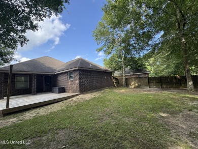 Don't miss out on this perfect home next to the serene Twin on Diamondhead Country Club in Mississippi - for sale on GolfHomes.com, golf home, golf lot