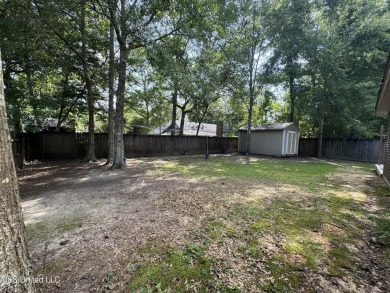 Don't miss out on this perfect home next to the serene Twin on Diamondhead Country Club in Mississippi - for sale on GolfHomes.com, golf home, golf lot