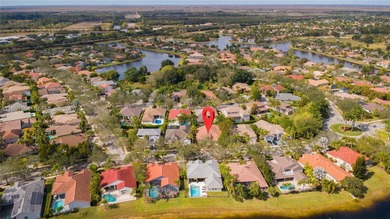 Discover this stunning one-story estate in Weston Hills on Weston Hills Country Club in Florida - for sale on GolfHomes.com, golf home, golf lot