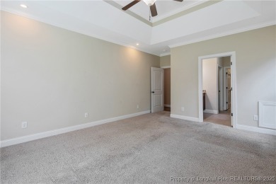 One of a kind custom, ranch-style home with courtyard entry and on Anderson Creek Golf Club in North Carolina - for sale on GolfHomes.com, golf home, golf lot