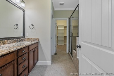 One of a kind custom, ranch-style home with courtyard entry and on Anderson Creek Golf Club in North Carolina - for sale on GolfHomes.com, golf home, golf lot