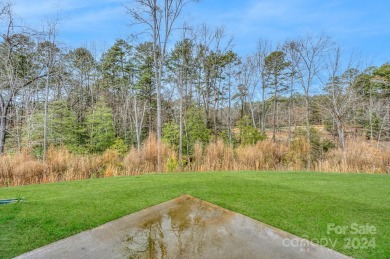Discover the epitome of comfort and charm in this Tillery on The Tillery Tradition Country Club in North Carolina - for sale on GolfHomes.com, golf home, golf lot