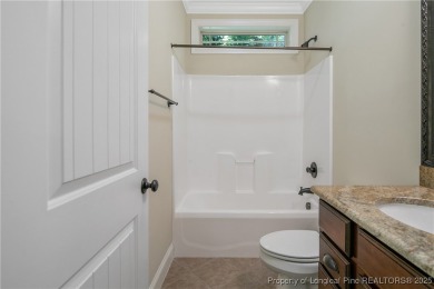 One of a kind custom, ranch-style home with courtyard entry and on Anderson Creek Golf Club in North Carolina - for sale on GolfHomes.com, golf home, golf lot