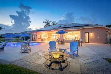 As soon as you enter this home, you are welcomed by the on Santa Lucia River Club in Florida - for sale on GolfHomes.com, golf home, golf lot