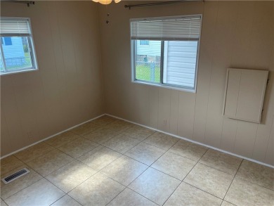 Welcome home to this 2 bed 1.5 bath beauty. Upgrades include on Barefoot Bay Golf Course in Florida - for sale on GolfHomes.com, golf home, golf lot