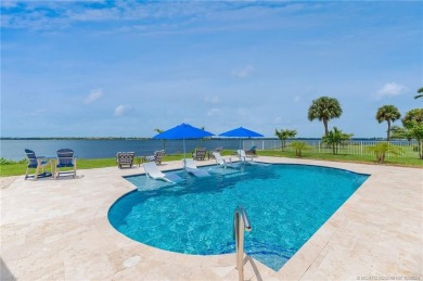 As soon as you enter this home, you are welcomed by the on Santa Lucia River Club in Florida - for sale on GolfHomes.com, golf home, golf lot