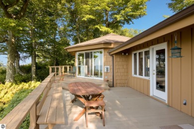 Nestled high among the woods, this lovely residence offers on Crystal Downs Country Club in Michigan - for sale on GolfHomes.com, golf home, golf lot