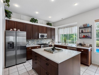 This updated waterfront pool home delivers an outstanding living on Westchase Golf Club in Florida - for sale on GolfHomes.com, golf home, golf lot