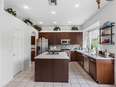 This updated waterfront pool home delivers an outstanding living on Westchase Golf Club in Florida - for sale on GolfHomes.com, golf home, golf lot