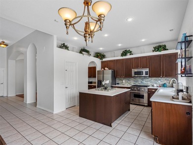 This updated waterfront pool home delivers an outstanding living on Westchase Golf Club in Florida - for sale on GolfHomes.com, golf home, golf lot