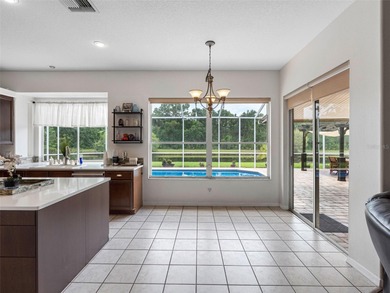 This updated waterfront pool home delivers an outstanding living on Westchase Golf Club in Florida - for sale on GolfHomes.com, golf home, golf lot