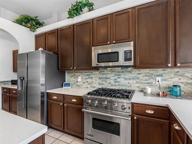 This updated waterfront pool home delivers an outstanding living on Westchase Golf Club in Florida - for sale on GolfHomes.com, golf home, golf lot