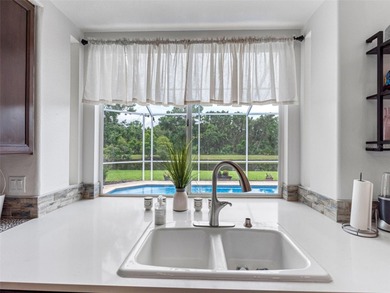 This updated waterfront pool home delivers an outstanding living on Westchase Golf Club in Florida - for sale on GolfHomes.com, golf home, golf lot