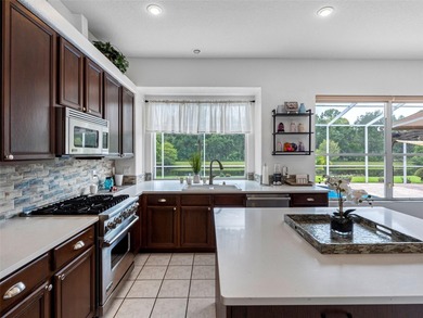 This updated waterfront pool home delivers an outstanding living on Westchase Golf Club in Florida - for sale on GolfHomes.com, golf home, golf lot