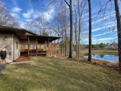 Set on a beautiful wooded 8+ acre lot this nicely updated 5 on Pine River Golf Club in Michigan - for sale on GolfHomes.com, golf home, golf lot