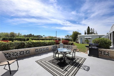 Under contract-accepting backup offers. The curb appeal of this on Maple Leaf Golf and Country Club in Florida - for sale on GolfHomes.com, golf home, golf lot