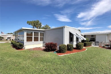 Under contract-accepting backup offers. The curb appeal of this on Maple Leaf Golf and Country Club in Florida - for sale on GolfHomes.com, golf home, golf lot