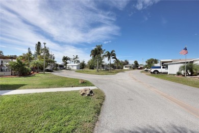 Under contract-accepting backup offers. The curb appeal of this on Maple Leaf Golf and Country Club in Florida - for sale on GolfHomes.com, golf home, golf lot