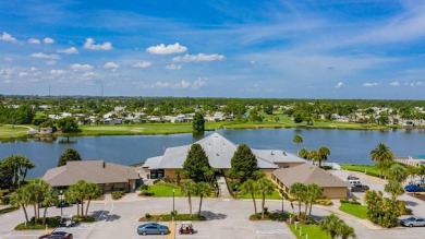 Under contract-accepting backup offers. The curb appeal of this on Maple Leaf Golf and Country Club in Florida - for sale on GolfHomes.com, golf home, golf lot