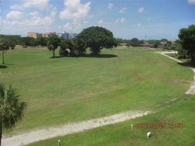 Lovely golf course view from large, screened patio (with on Palm-Aire Country Club and Resort - Palms in Florida - for sale on GolfHomes.com, golf home, golf lot